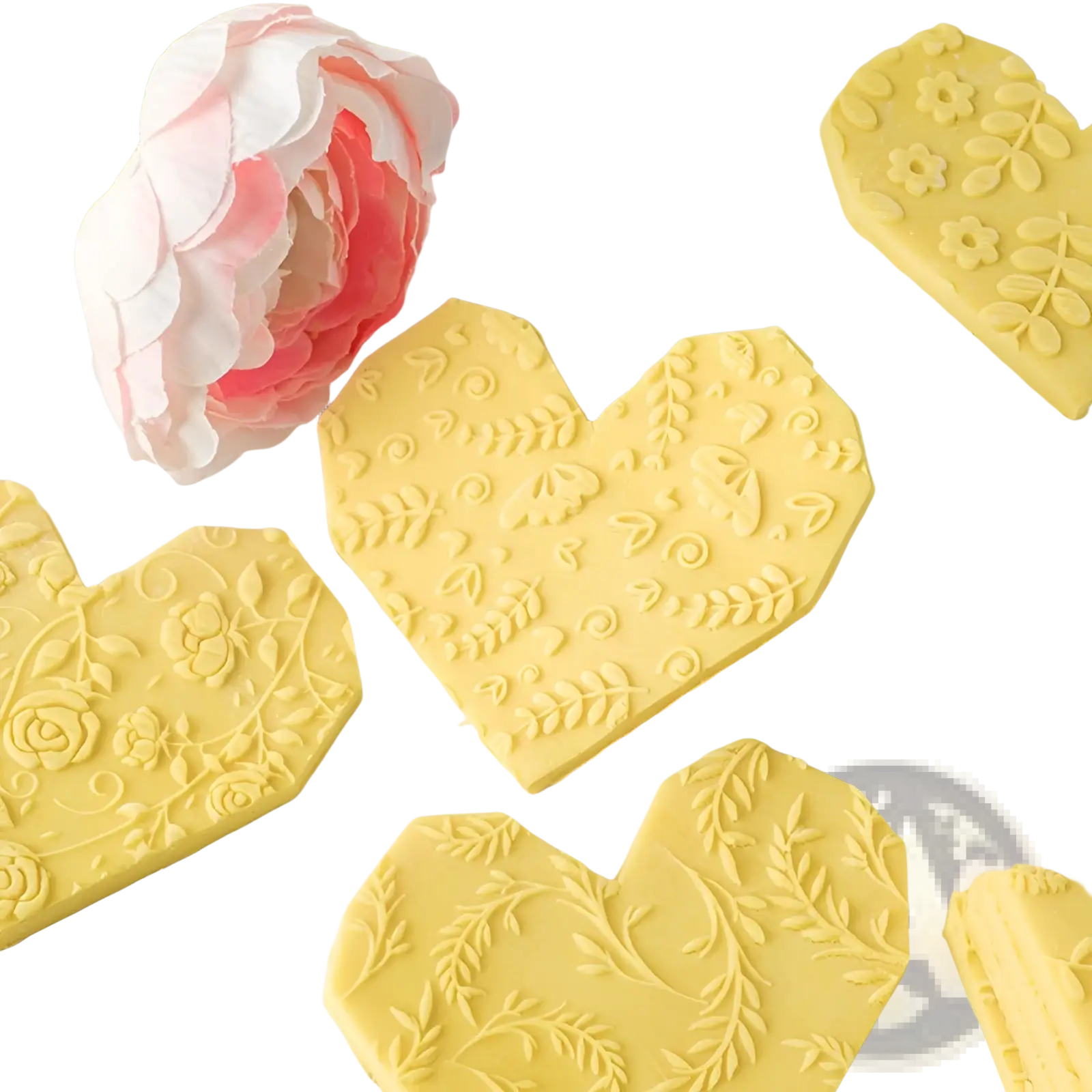 Yellow heart-shaped chocolate pieces with floral and leaf embossing made using a floral embossed beech wood rolling pin