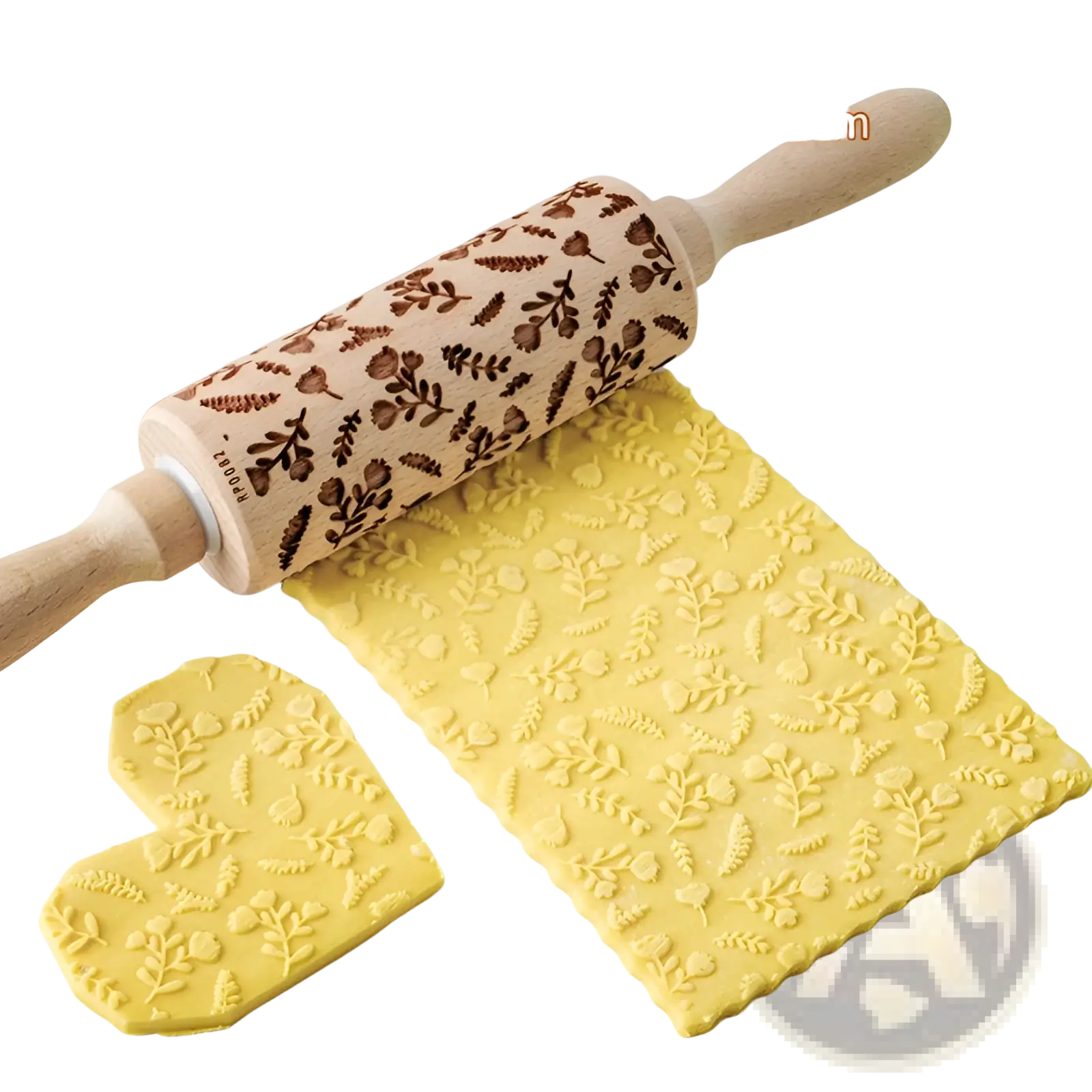 A wooden floral embossed beech wood rolling pin with engraved leaves acorns and light wood handles for baking