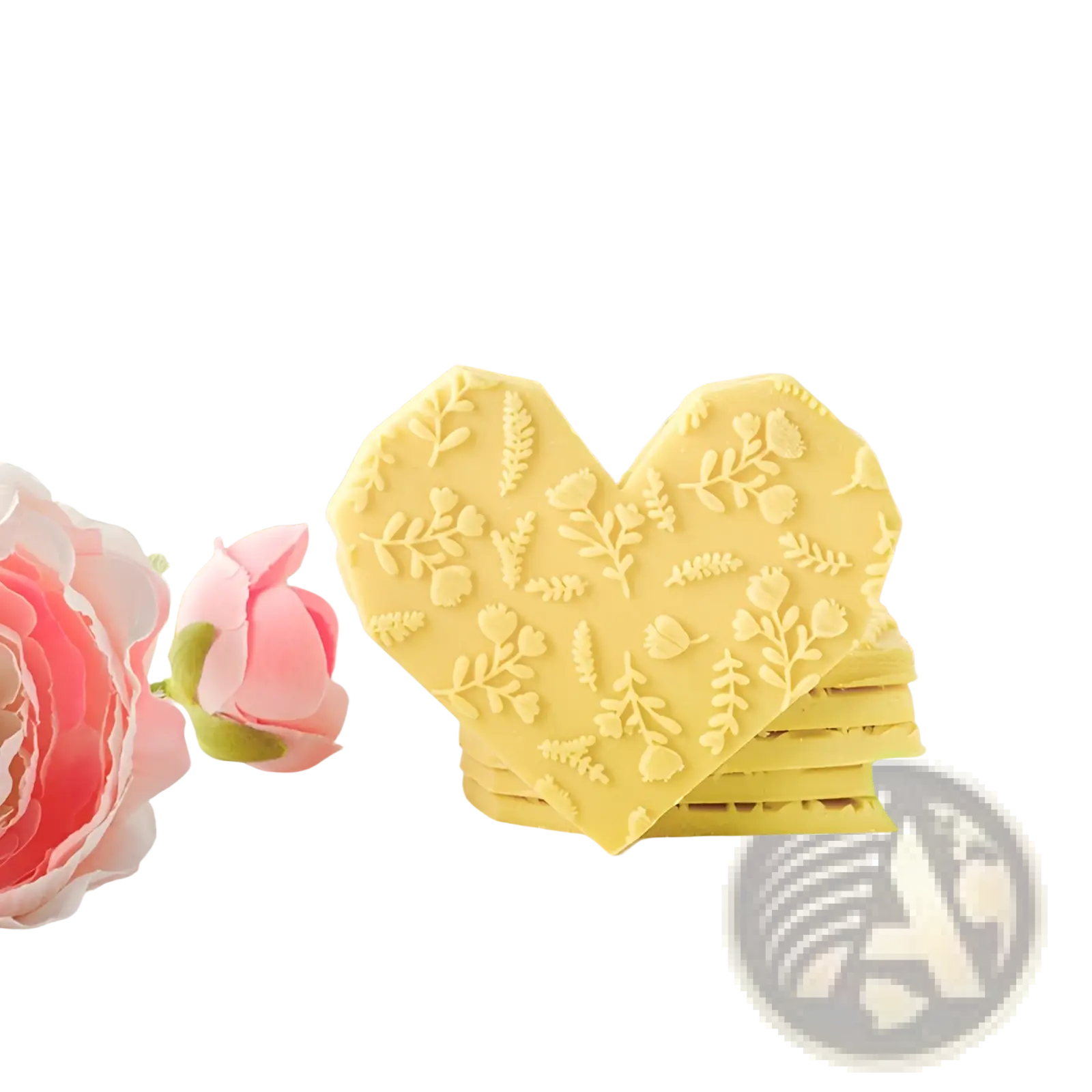 Yellow heart-shaped beech wood coasters with embossed floral patterns complementing a floral embossed rolling pin