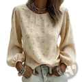 Beige long-sleeved blouse with delicate white daisy embroidery and puffed sleeves in floral design