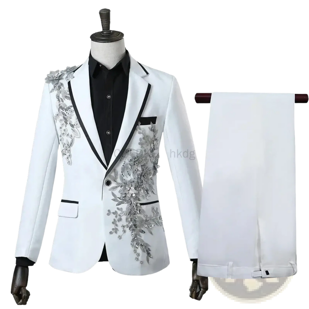 White blazer with silver floral embroidery and black trim paired with matching white trousers for formal occasions