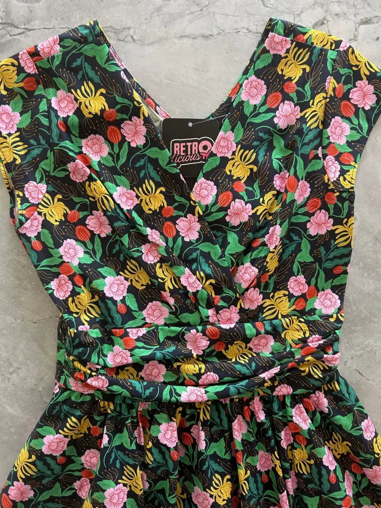 Floral greta green vintage cotton v neck dress in black fabric with pink blossoms yellow tulips and green leaves print