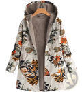 A cozy off-white floral hooded winter parka with orange and brown blossoms on textured fabric lined with gray fleece