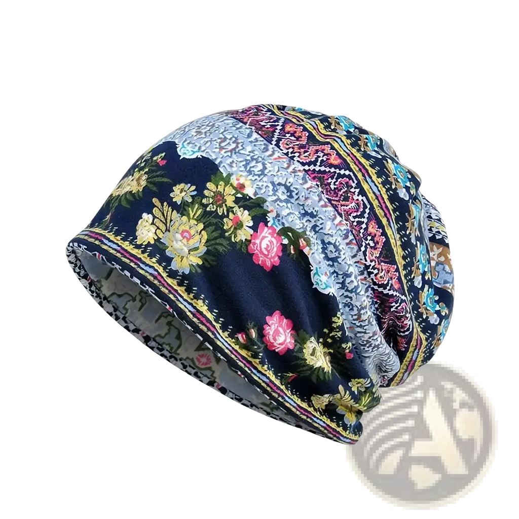 A navy blue floral knit beanie hat with intricate pink yellow and teal lace paisley trim for unisex casual autumn wear