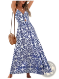 A flowing blue and white patterned maxi dress with a halter neckline and floral knotted v neck spaghetti straps
