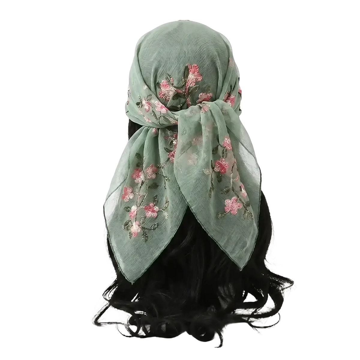 A delicate mint green floral lace hijab wrap with pink floral embroidery tied elegantly around the head