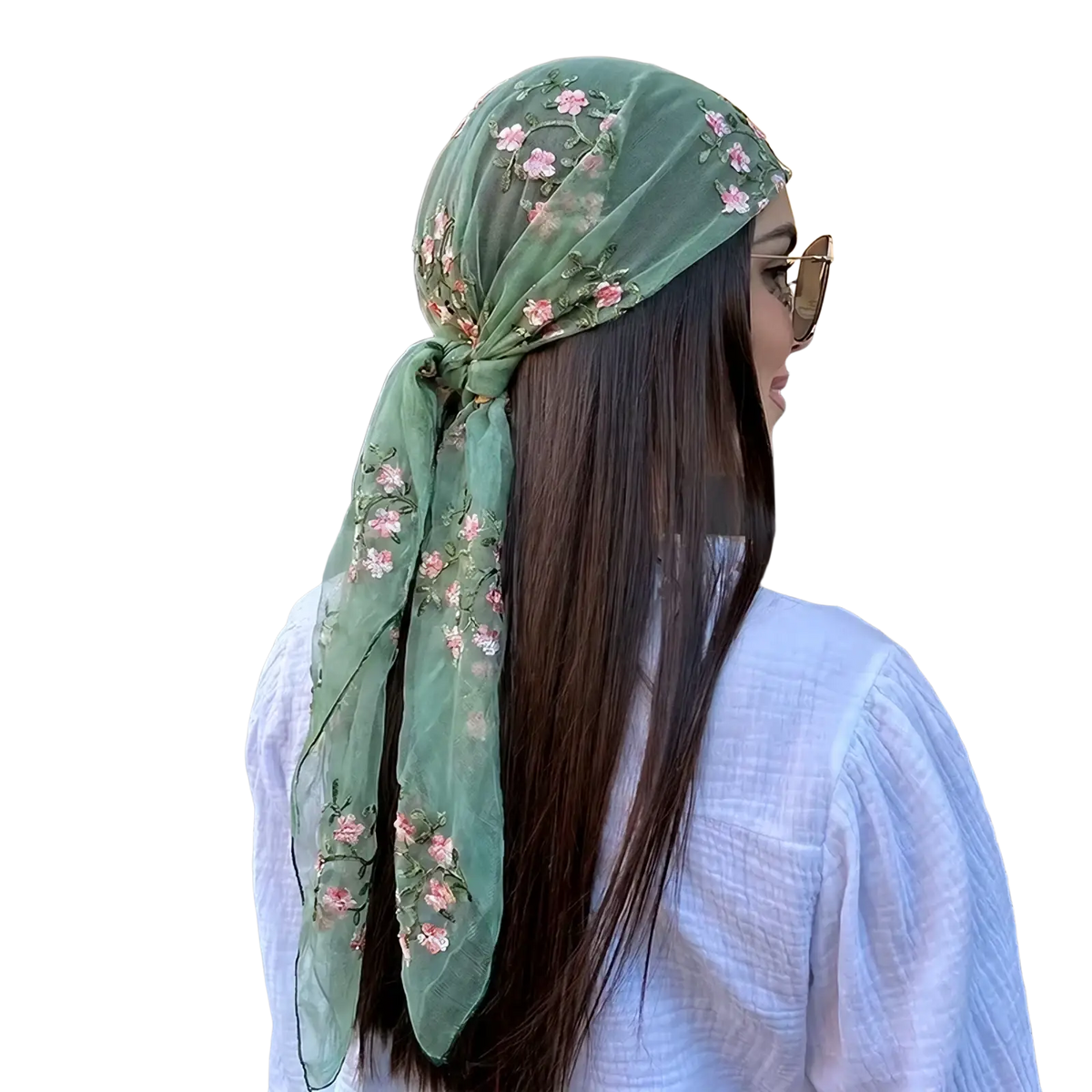 A delicate sage green sheer floral lace hijab wrap shawl with pink embroidery tied elegantly around the head