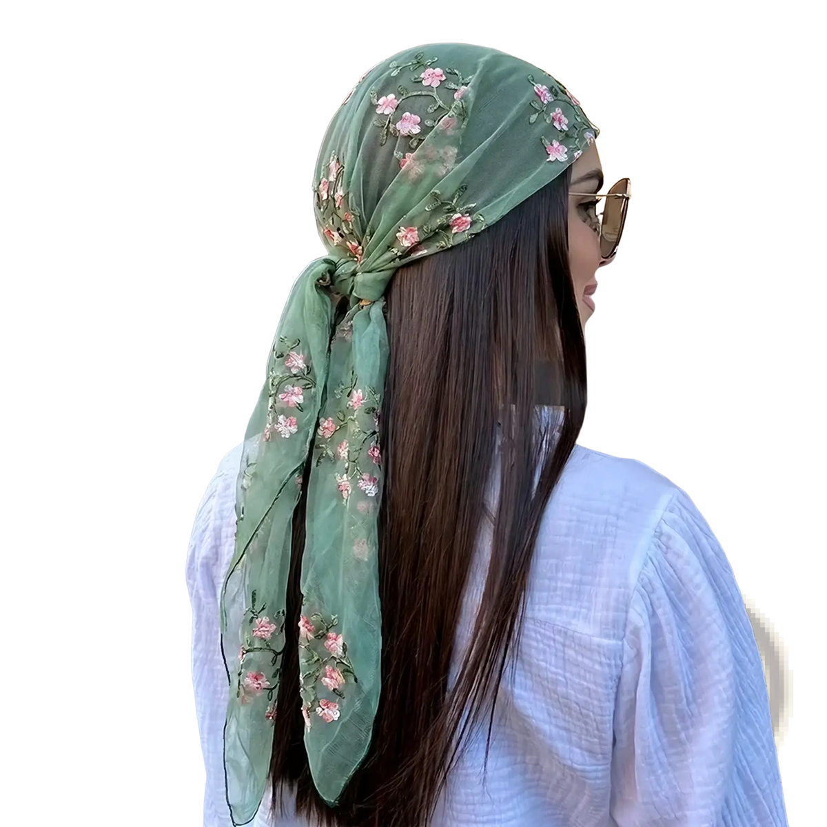 A delicate sage green sheer floral lace hijab wrap shawl with pink embroidery tied elegantly around the head