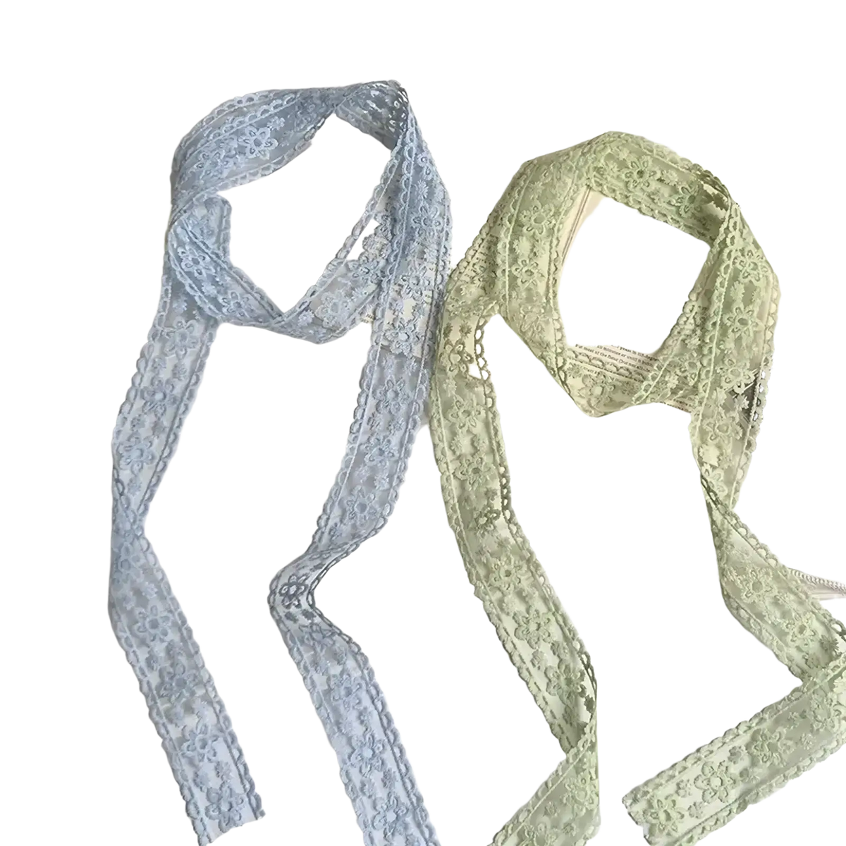 Two delicate floral lace scarves in soft blue and pale green designed as hair bows and ribbon wraps
