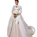 Elegant white floral lace wedding gown with stand collar long sleeves and intricate embroidery on bodice and skirt