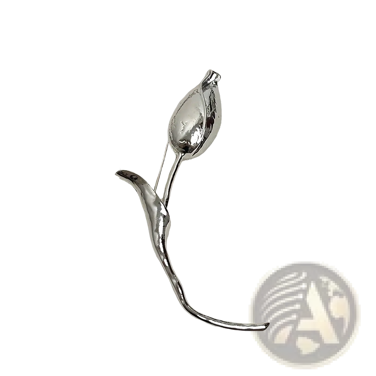 A sleek silver-toned metal floral brooch pin shaped like a stylized lotus bud with an elongated stem for lapels
