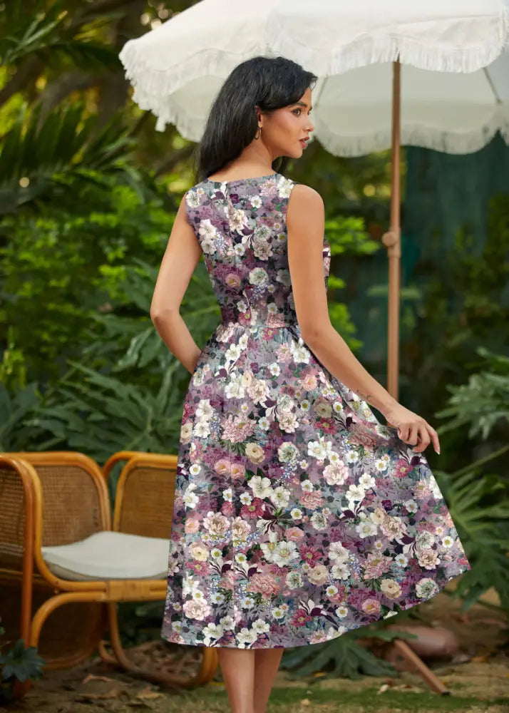 Vintage floral cotton midi dress with pockets featuring a sleeveless knee-length design and purple pink floral pattern