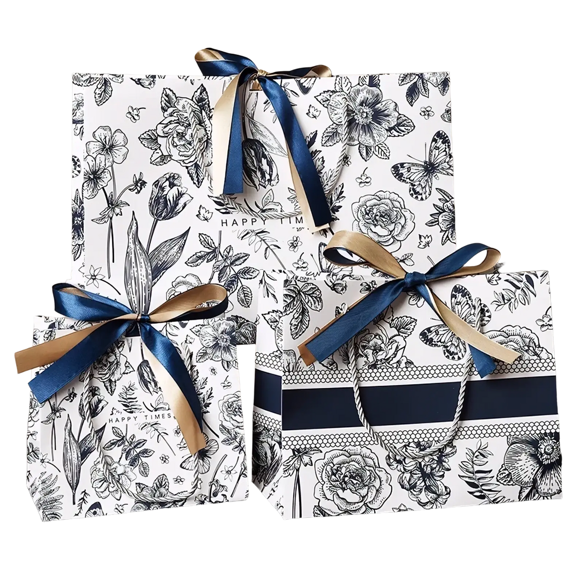 Three elegant floral paper gift bags with black and white patterns accented by navy blue and gold ribbons