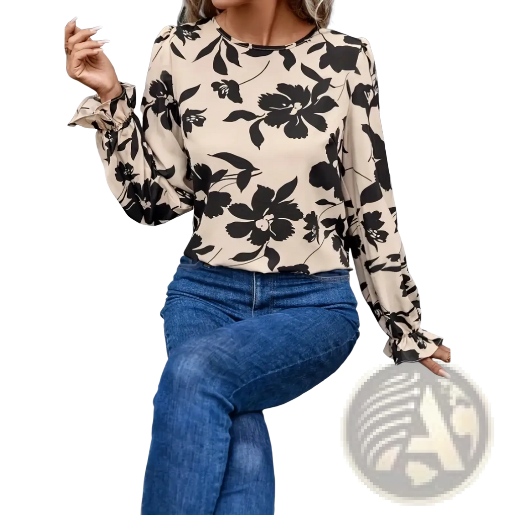 Beige floral print backless blouse with black blossoms and leaves featuring long sleeves and ruffled cuffs