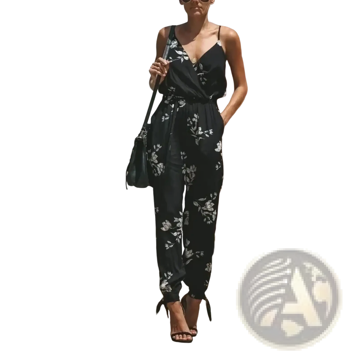 Black floral print boho summer jumpsuit with thin straps and cinched waist ideal for casual wear