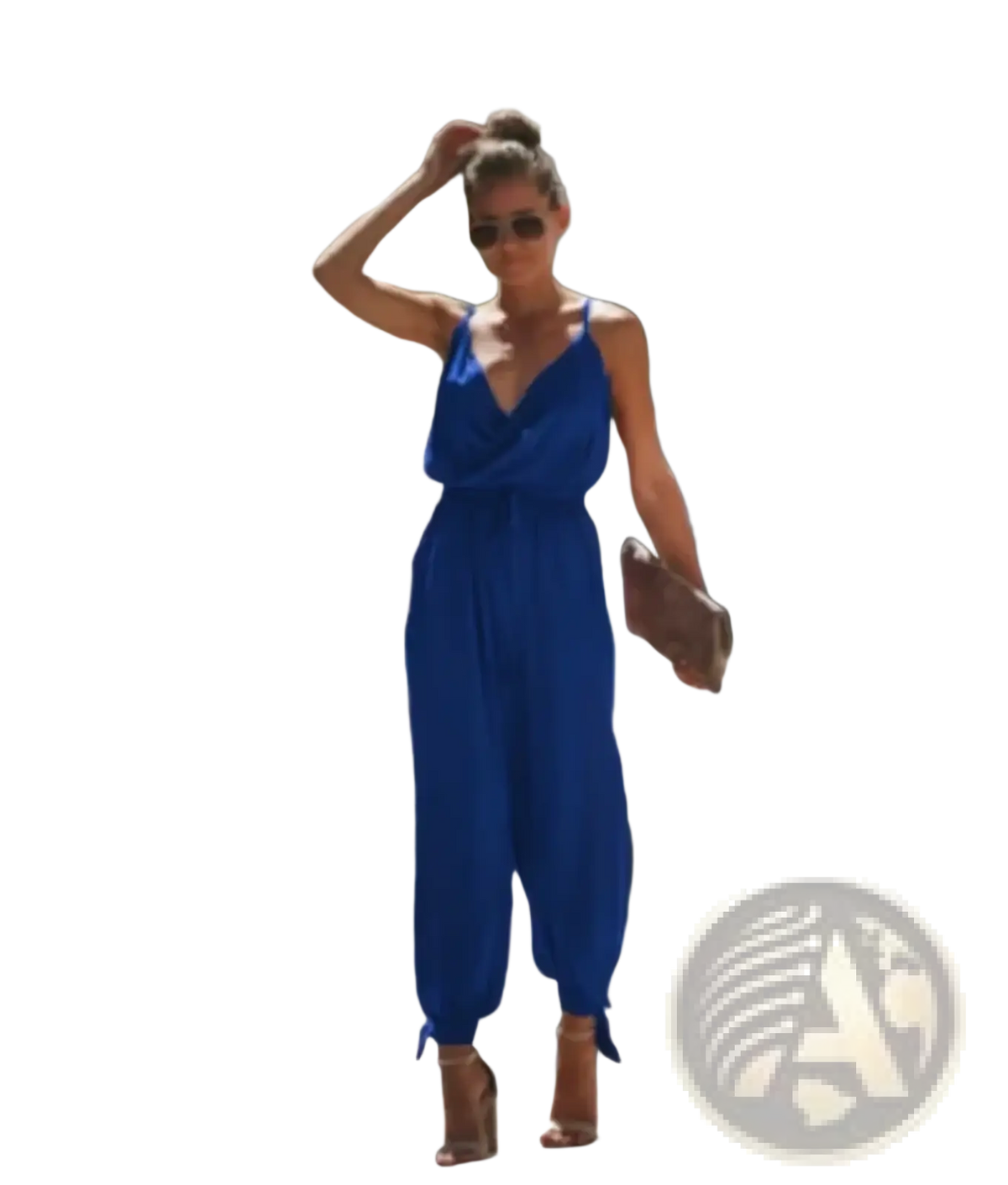 A vibrant royal blue sleeveless jumpsuit with v-neckline tied waistband and cuffed ankles floral print boho summer jumpsuit