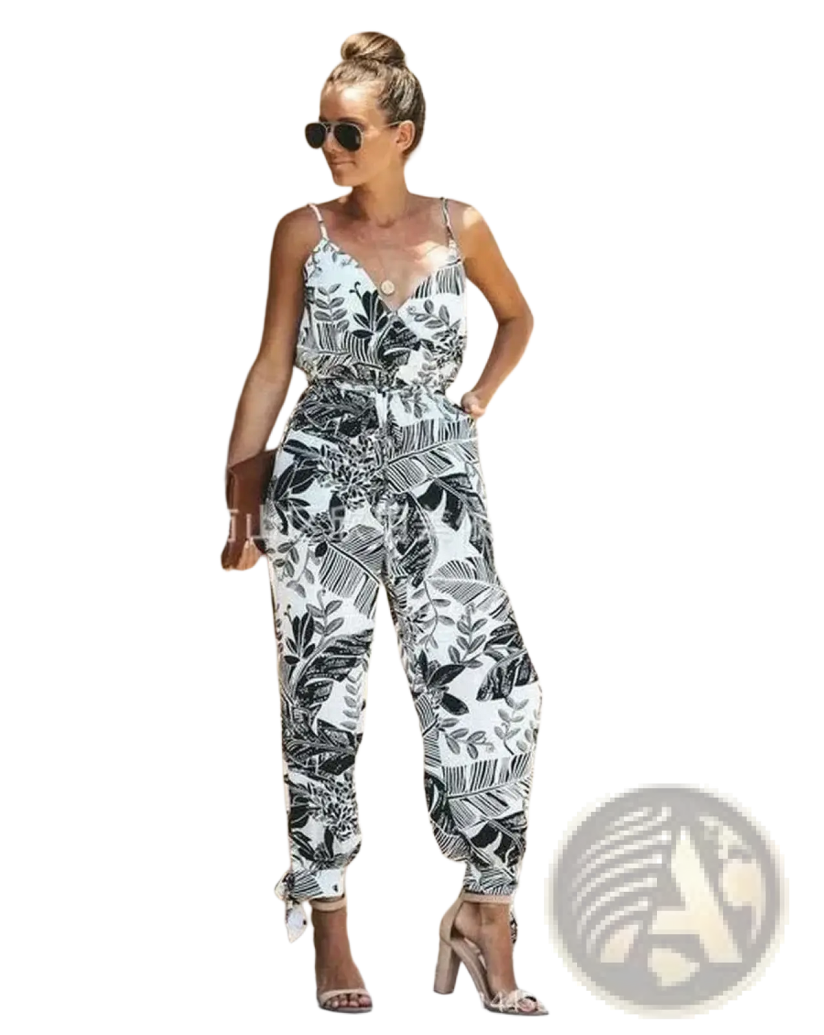 White and black tropical leaf print boho summer jumpsuit with thin spaghetti straps v-neckline and cuffed hems