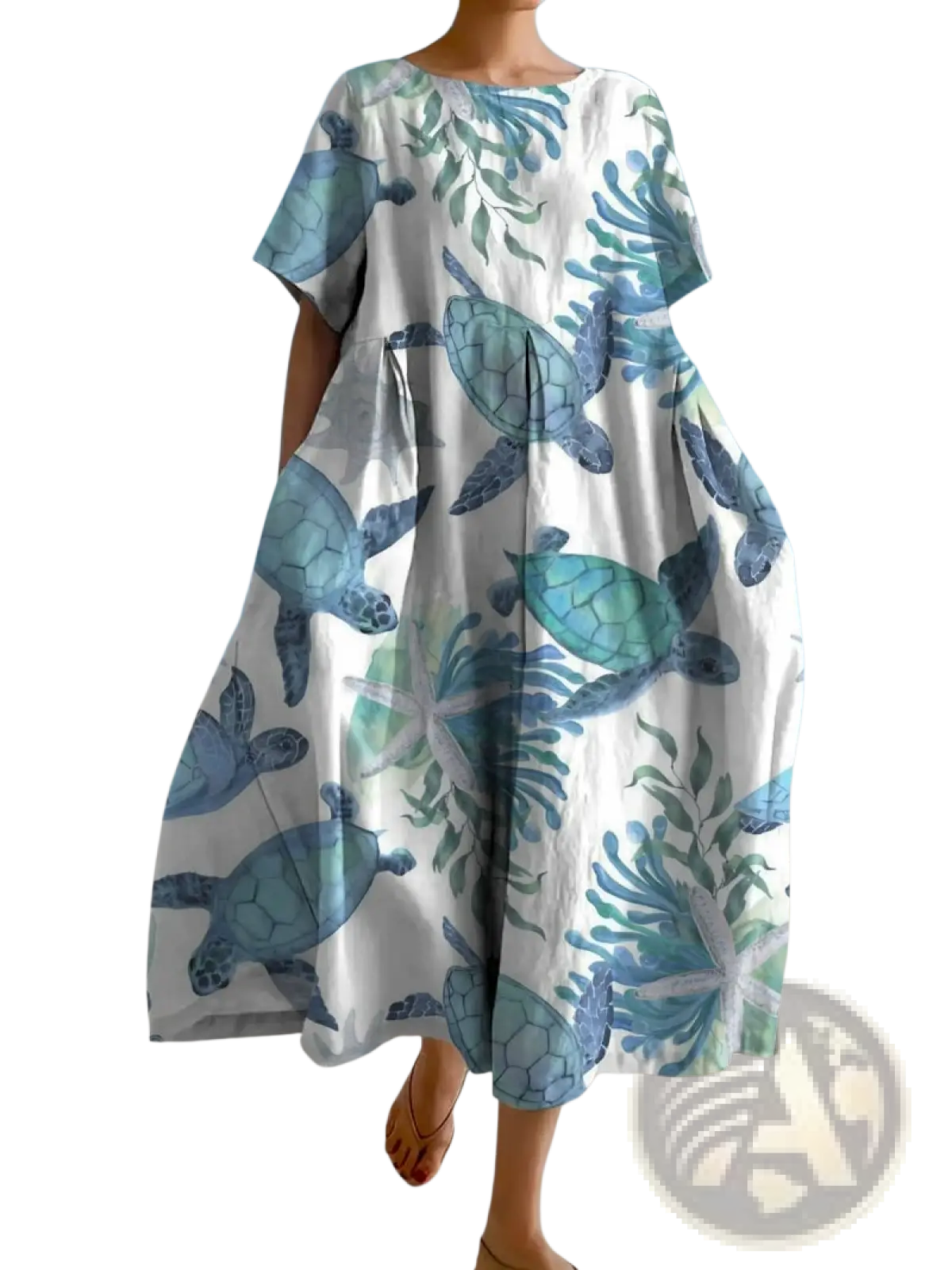 A flowing white linen plus size maxi dress with blue and green sea turtle floral print and short sleeves in oversized silhouette