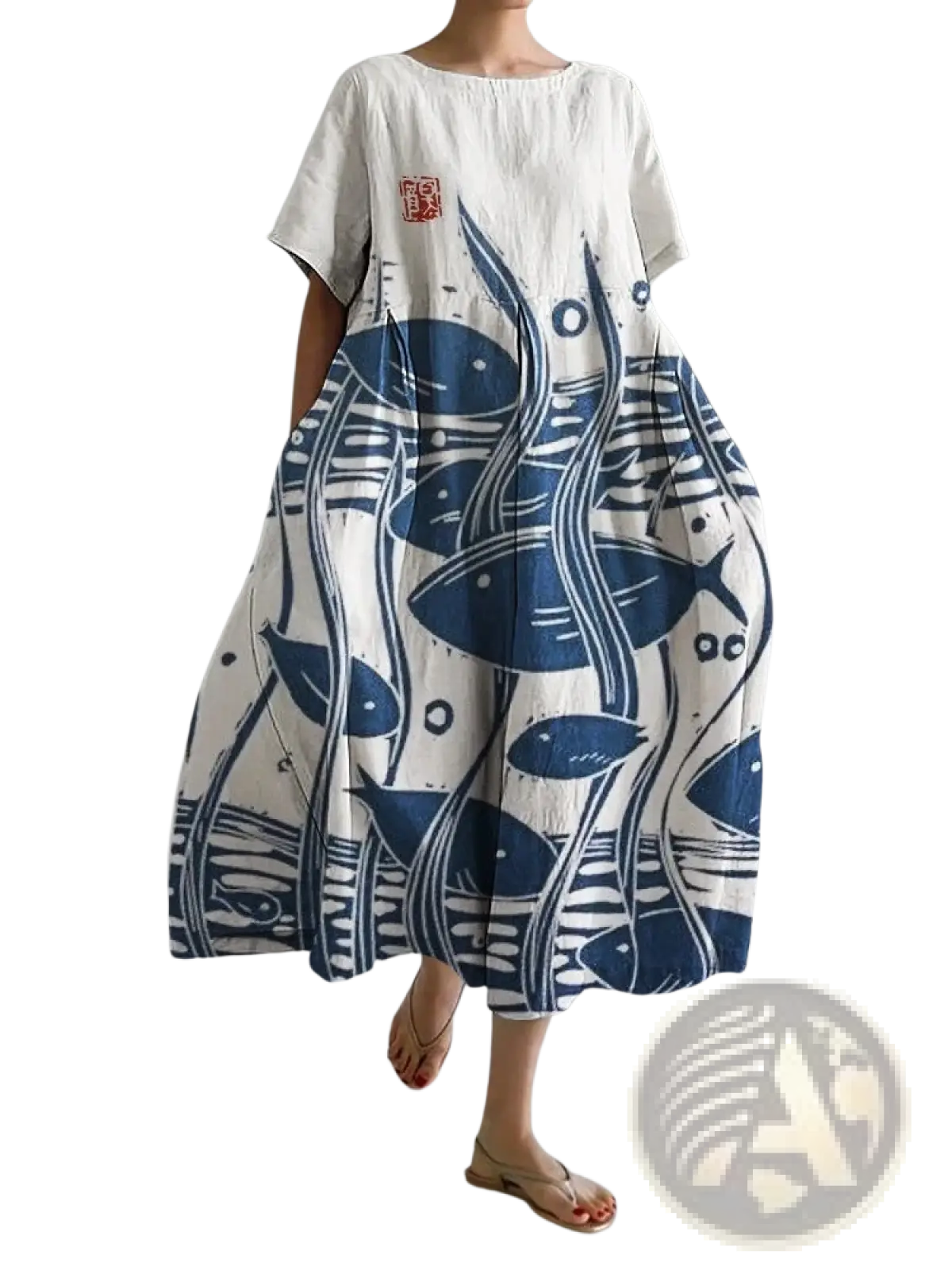 A flowing white linen floral print a-line plus size maxi dress with bold blue fish seaweed print and red chest patch