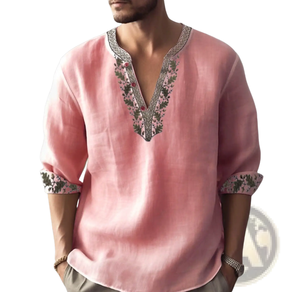 A soft pink floral print linen shirt with v neck and green gray embroidered detailing for summer pullover