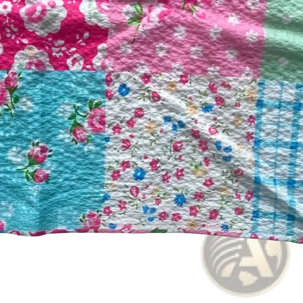 Floral print long sleeve button up shirt with vibrant patchwork quilt patterns in pink blue white and mint green