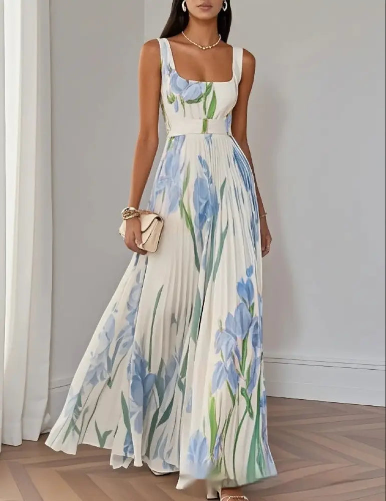 Ivory floral iris pleated maxi dress with square neck featuring delicate blue iris pattern and flowing fabric movement