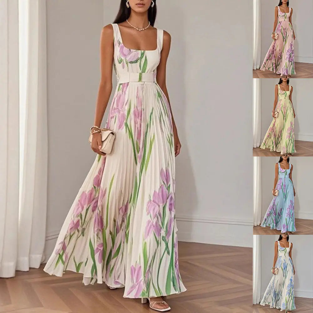 A flowing white floral iris pleated maxi dress with square neckline thin straps and vibrant pink and green pattern