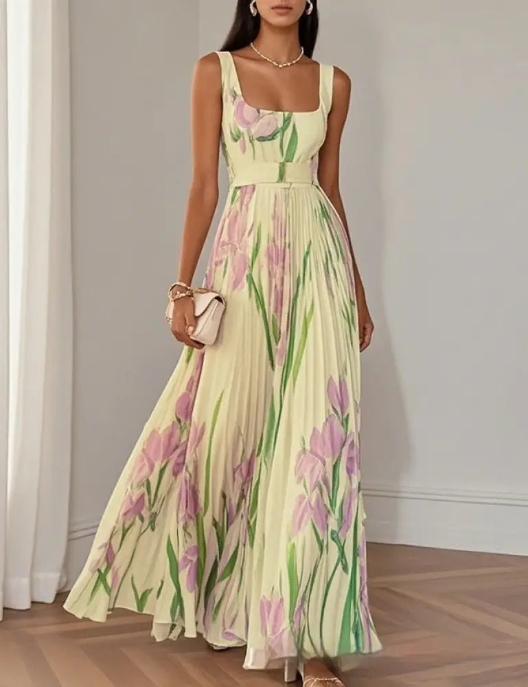 A flowing pale yellow floral iris pleated square neck maxi dress with pink irises and green stems pattern