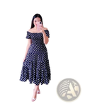A navy blue off-the-shoulder midi dress with white polka dots ruffled sleeves and a smocked tiered design