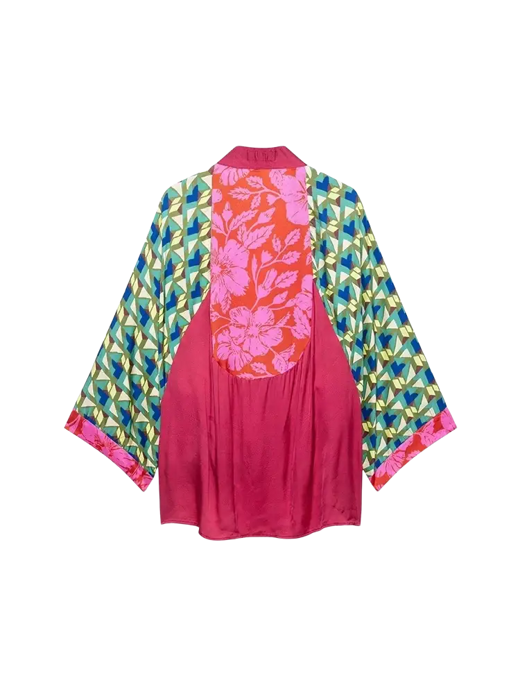 A vibrant pink satin kimono from the floral print two piece midi skirt set with bold orange floral panel and geometric sleeves