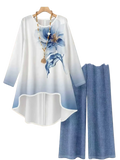 A flowing white and blue gradient floral print blouse with matching wide-leg denim pants two-piece outfit set