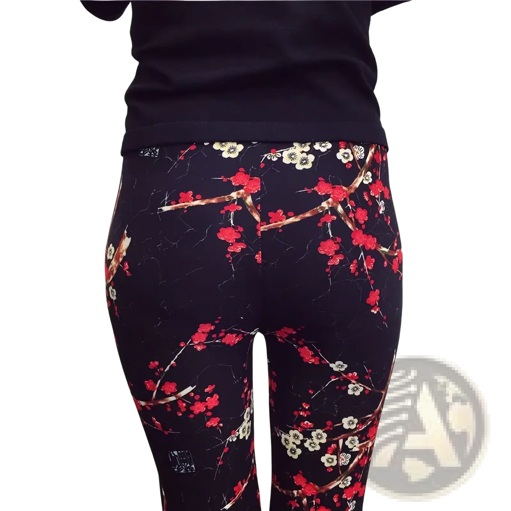 Floral print workout leggings for women in black with red and white blossoms on brown branches pattern