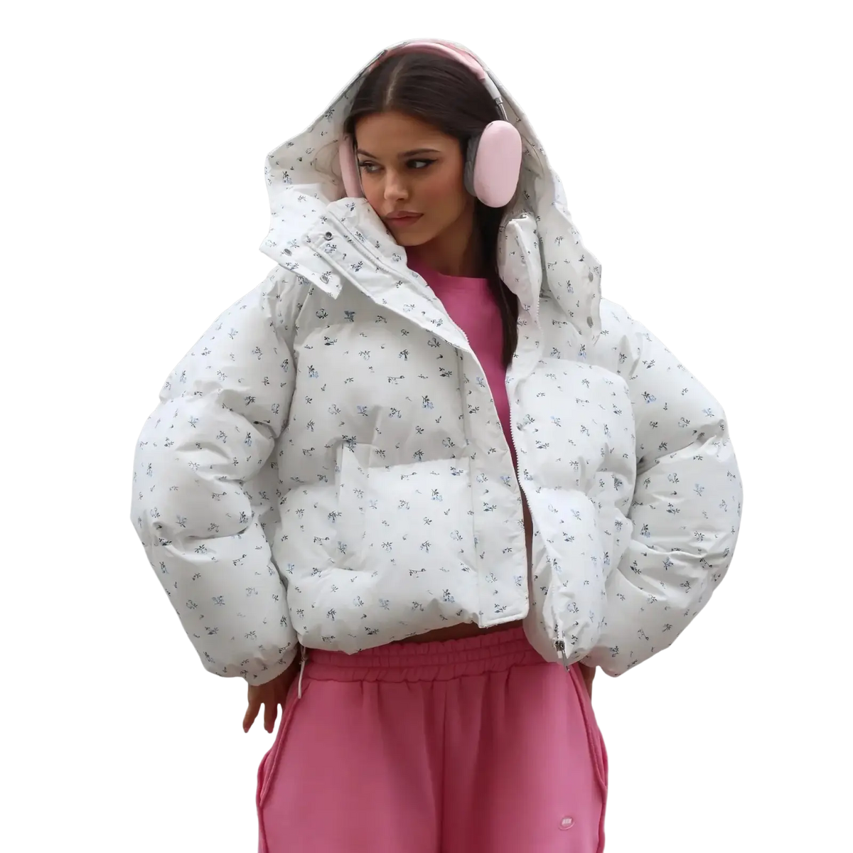 White floral puffer jacket with hood featuring subtle black pattern paired with pink earmuffs for winter outerwear