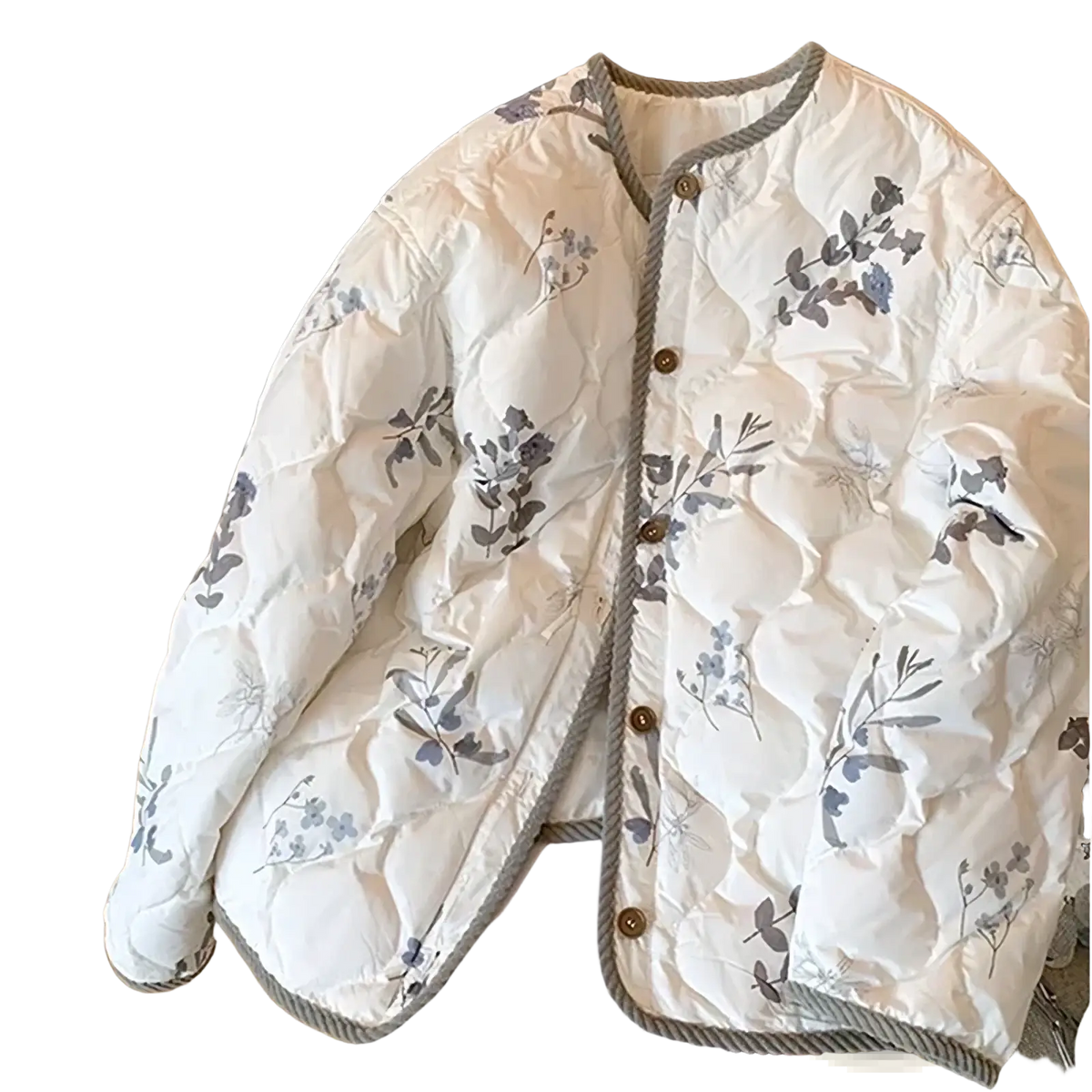 A cream-colored floral quilted bomber jacket featuring brown buttons and ribbed trim for winter wear