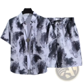 Black and white abstract tie-dye floral shirt and shorts set with button-up short sleeves in retro tropical print