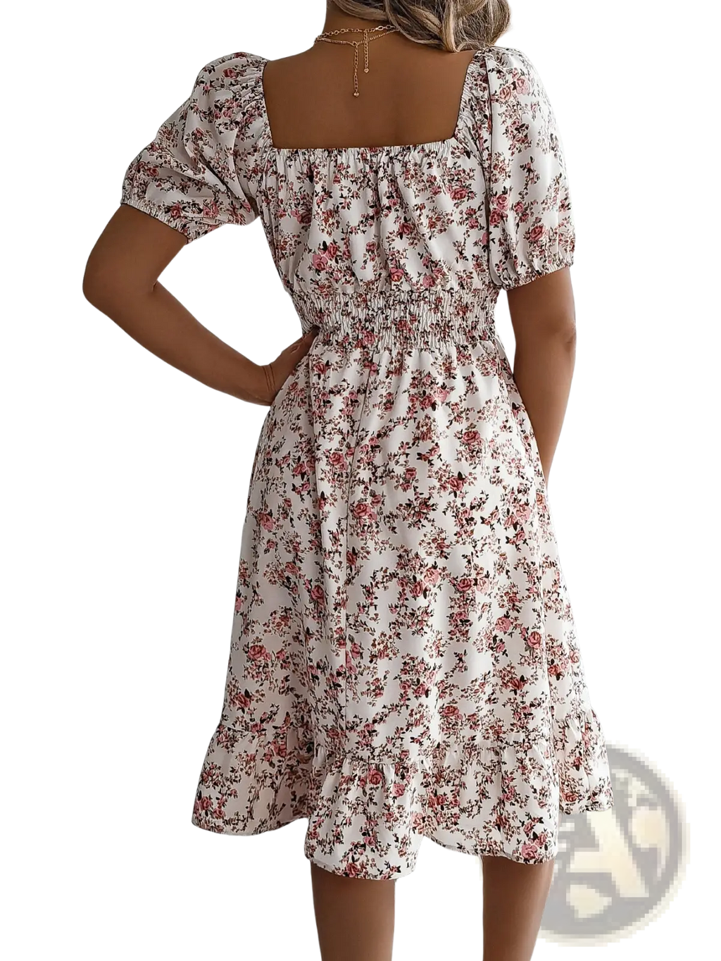 A woman wearing a white floral print summer dress with puffed short sleeves and a square neckline