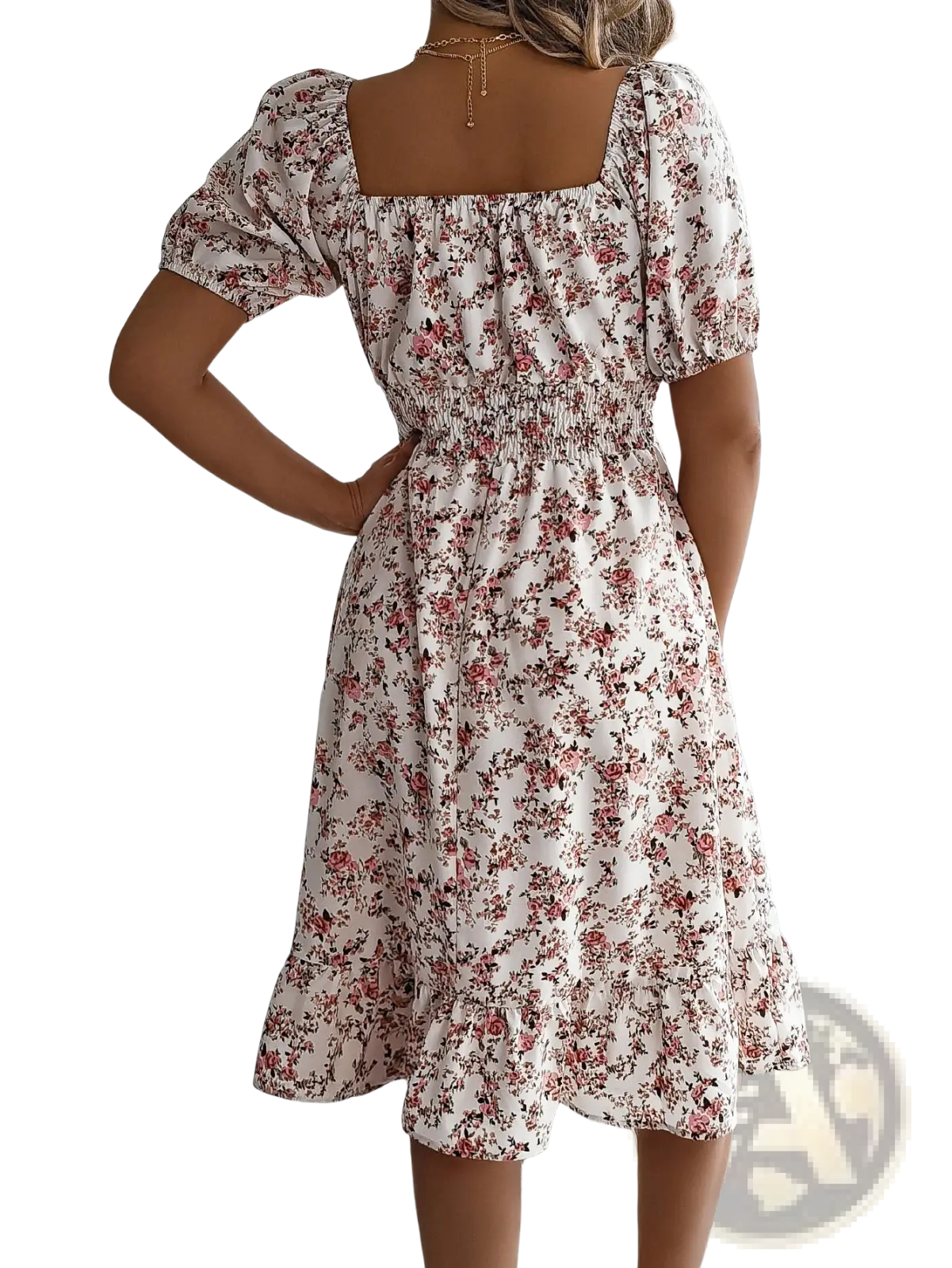 A woman wearing a white floral print summer dress with puffed short sleeves and a square neckline