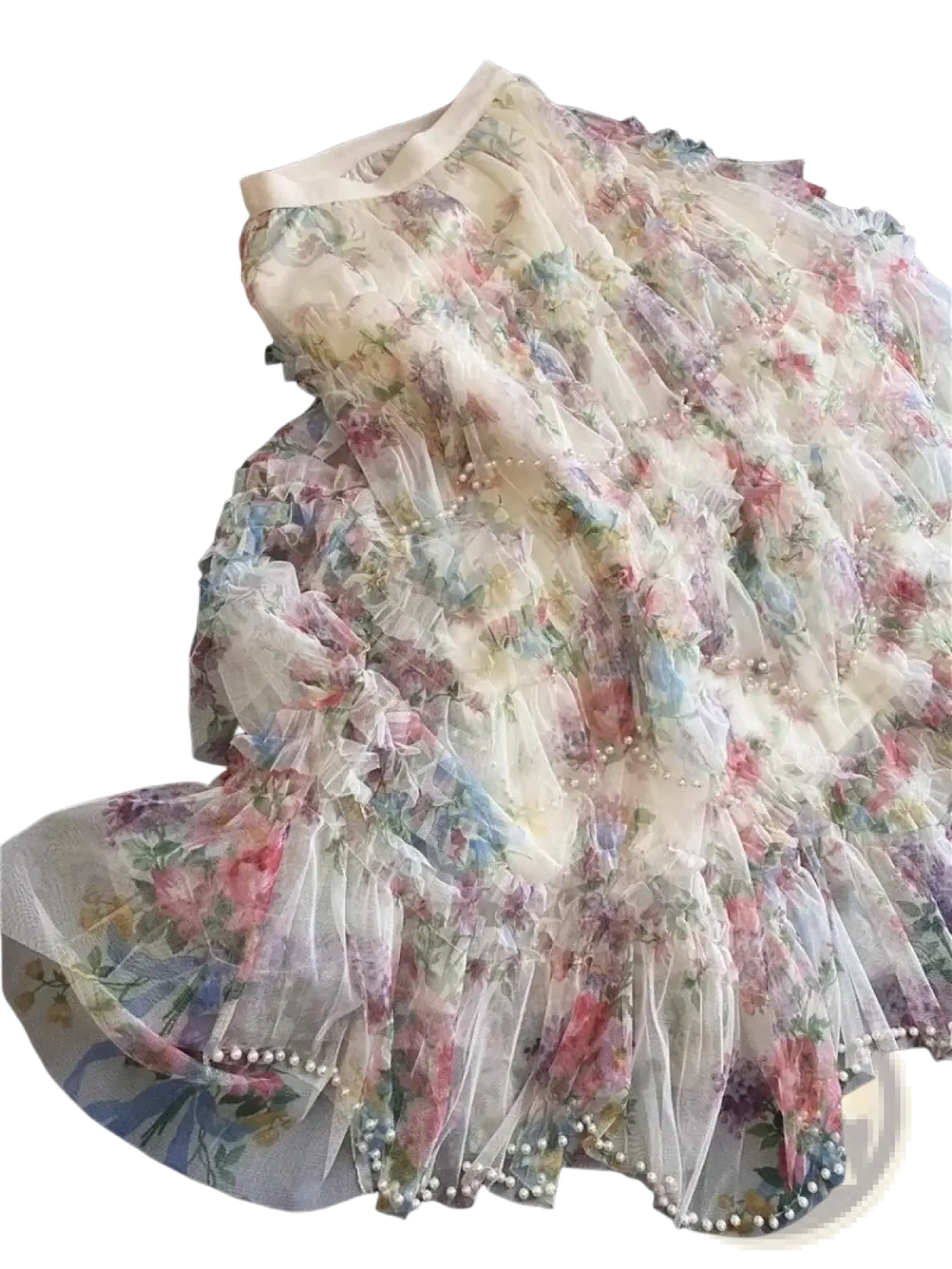 A floral tulle fairycore skirt in soft pastel hues with multi-layered fabric and pearl trim along the hem