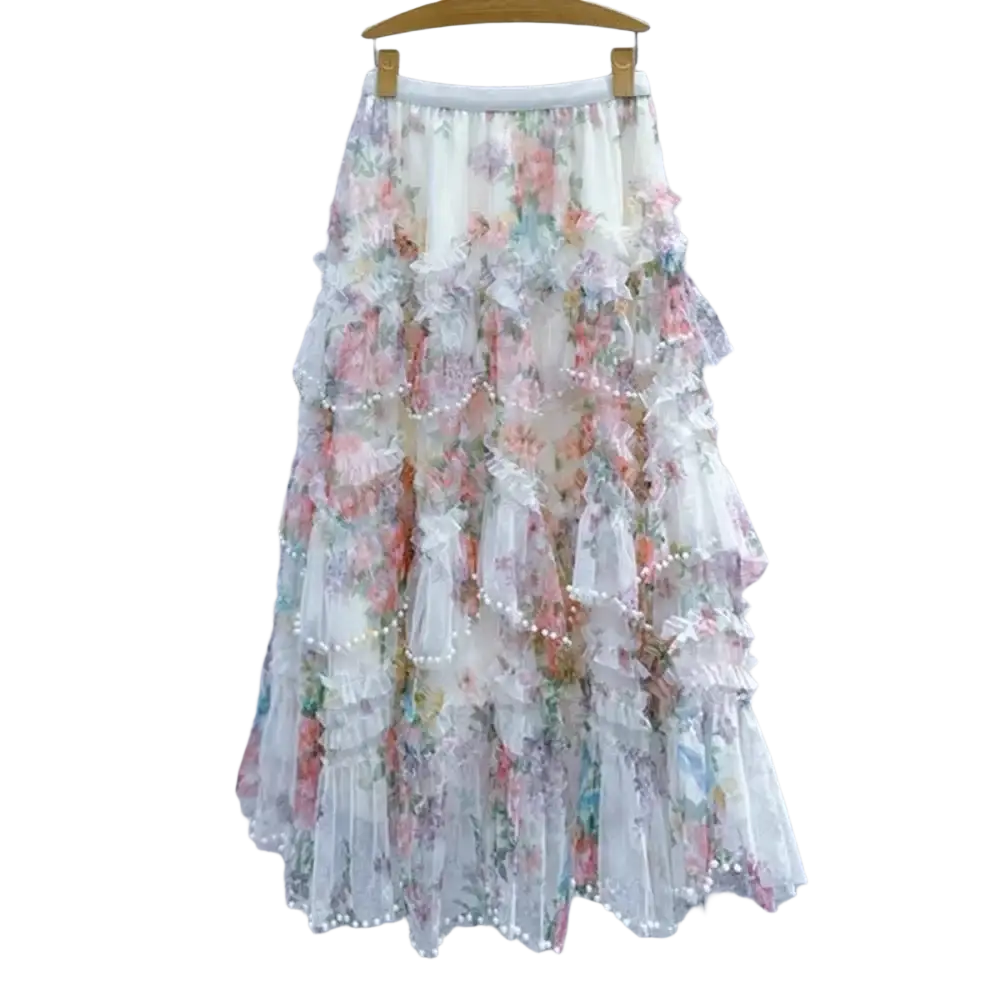 A delicate tiered floral tulle fairycore skirt in soft pastel hues with lace and pearl trim y2k style