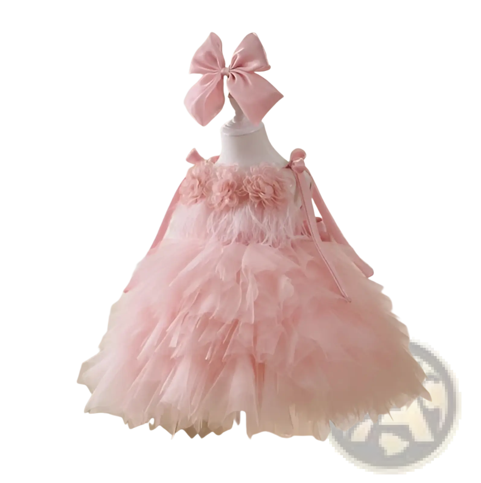 A delicate pink floral tulle tutu flower girl wedding dress with floral embellishments and matching bow headband