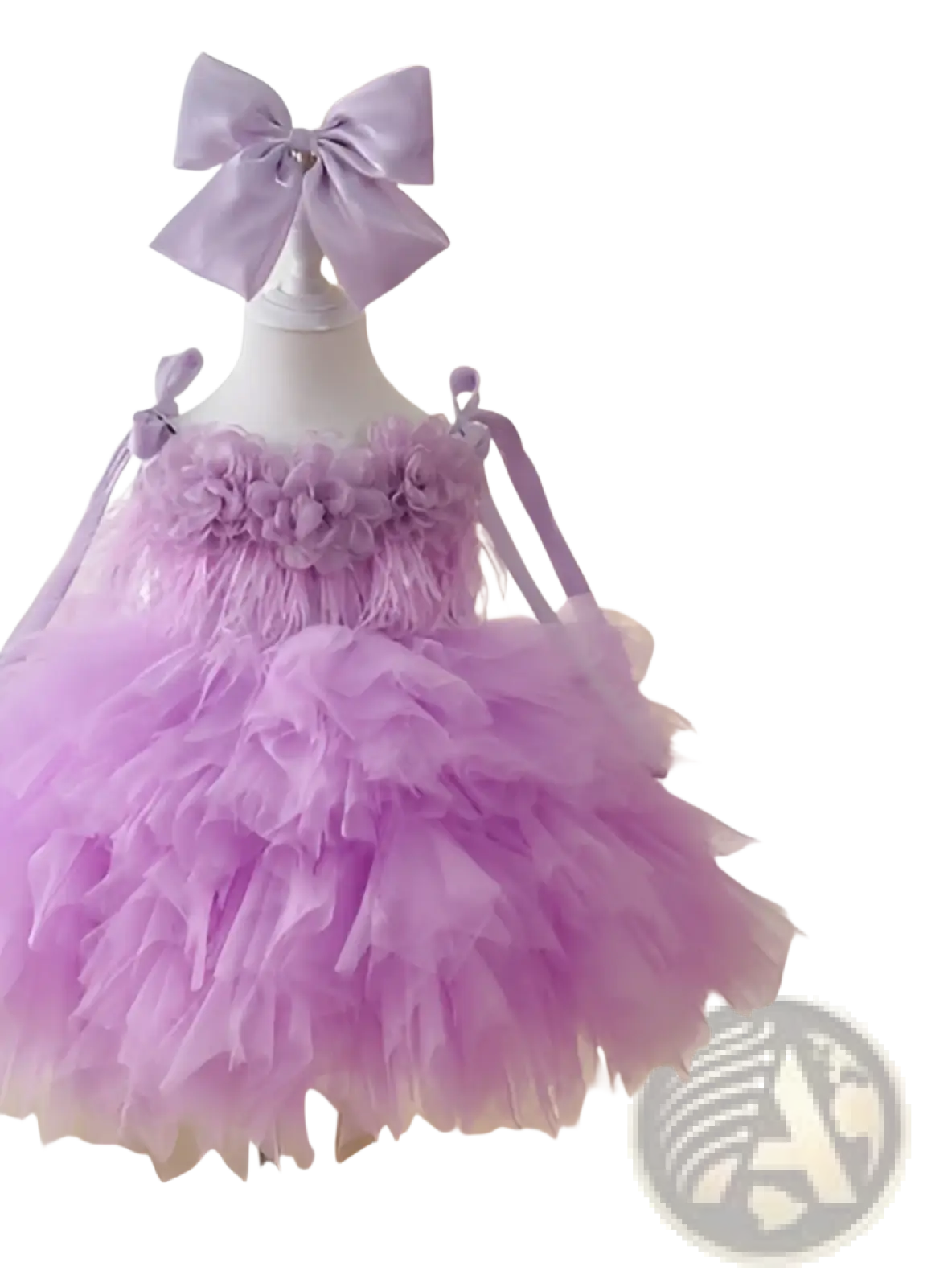 A delicate lavender floral tulle tutu flower girl wedding dress with a ruffled layered skirt and floral bodice embellishments