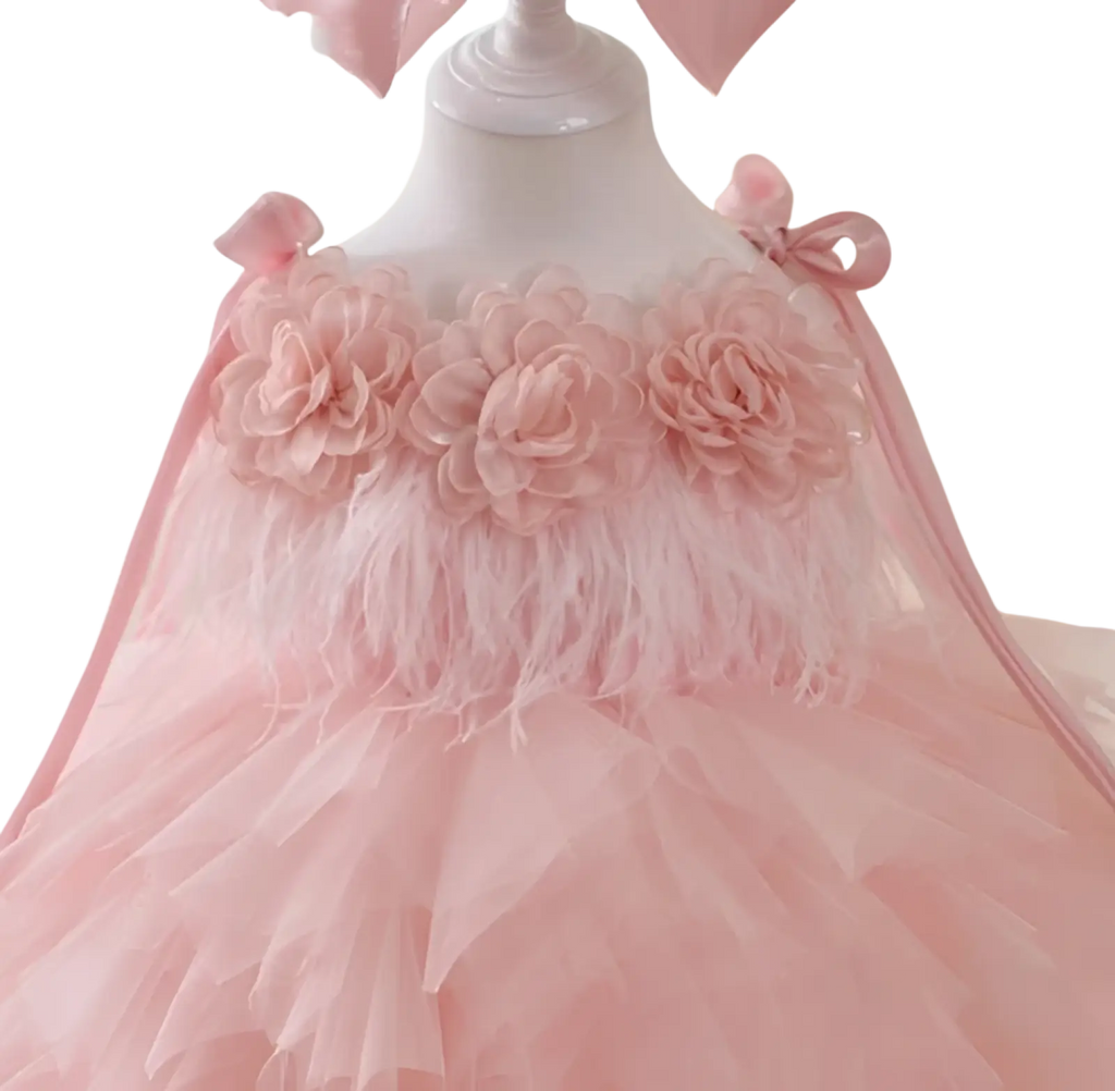 Floral tulle tutu flower girl wedding dress in delicate pink with soft fabric flowers and feather trim