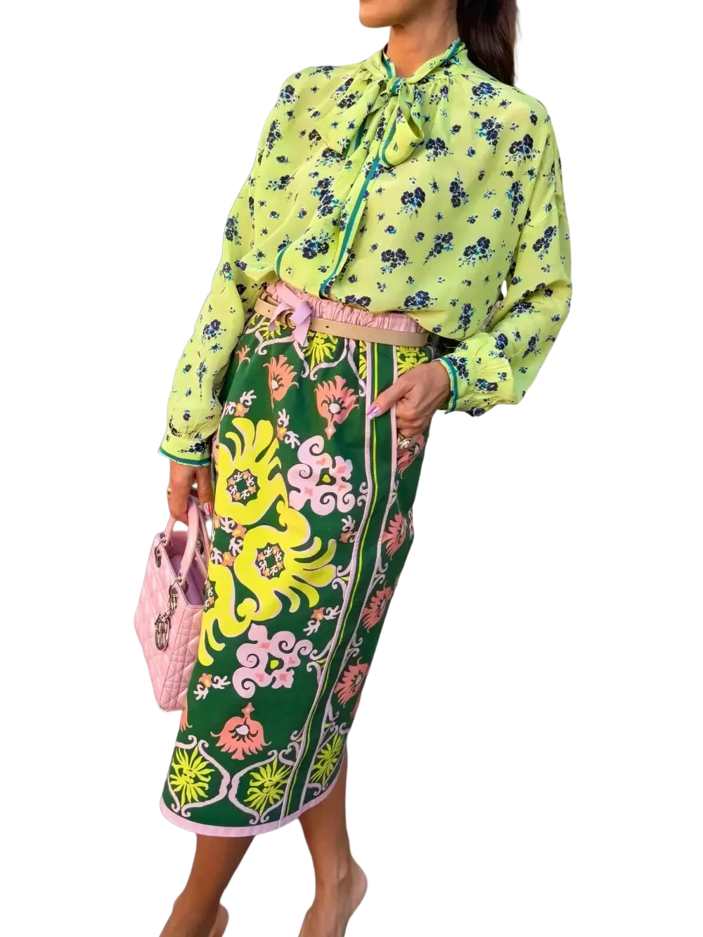 A vibrant green floral two piece midi skirt set with bold yellow and pink patterns and matching pink hem trim