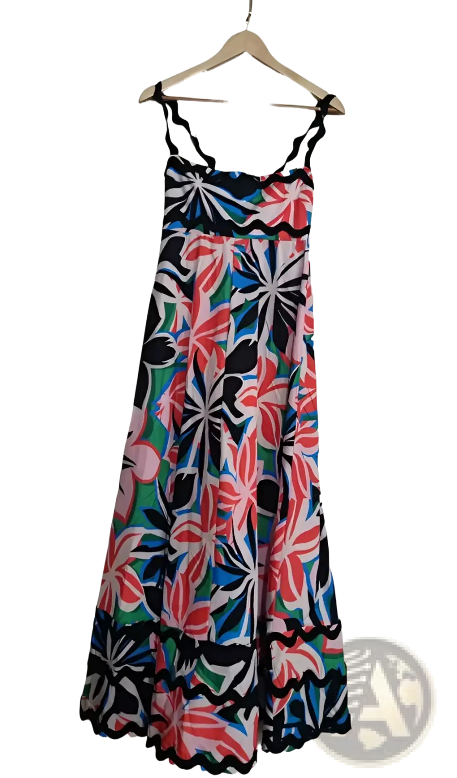A vibrant floral wavy trim a-line beach maxi dress with black spaghetti straps and bold pink blue green blossoms