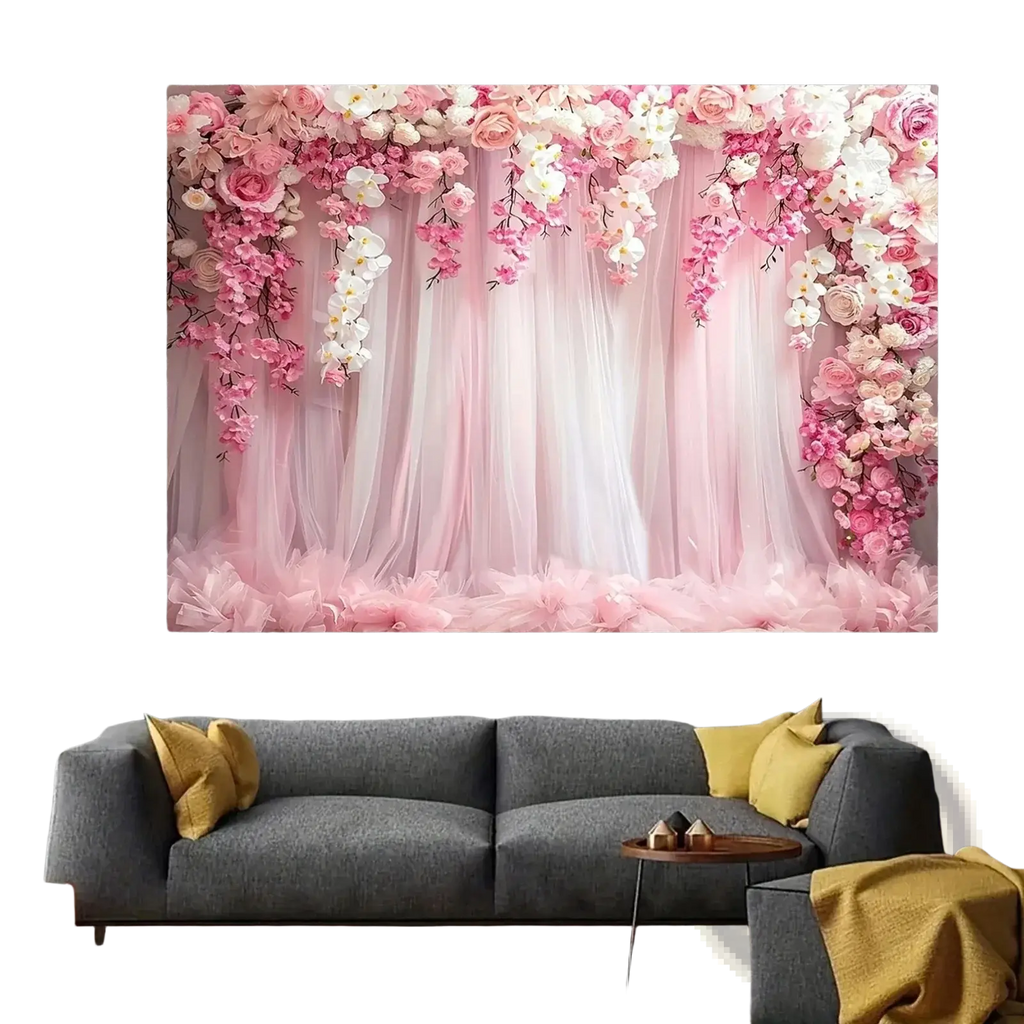 Floral wedding backdrop featuring pink tulle with cascading roses and orchids framing sheer curtains