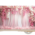 Floral wedding backdrop with tulle featuring delicate pink and white cascading roses orchids and cherry blossoms