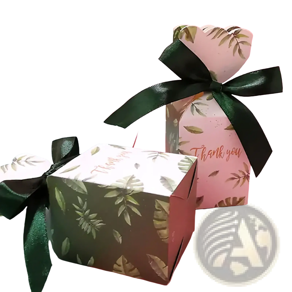 Floral wedding favor boxes with ribbons in dark green and light pink paper featuring leaf patterns and black glossy ribbons