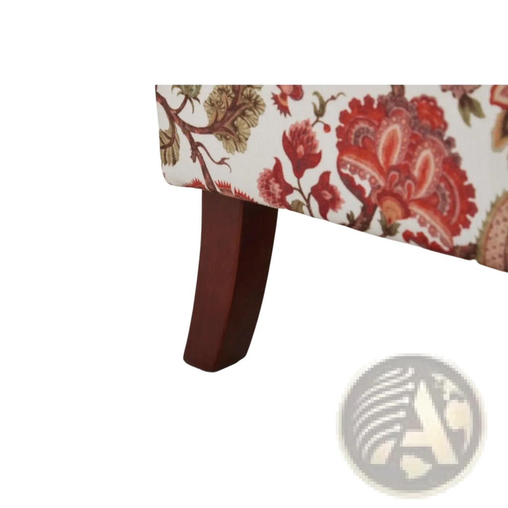 Floral wingback accent chair featuring a dark reddish-brown wooden leg with a curved elegant design supporting floral upholstery