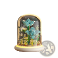 A glowing translucent glass dome encases a miniature lego-style turquoise and green flower building block decor toy