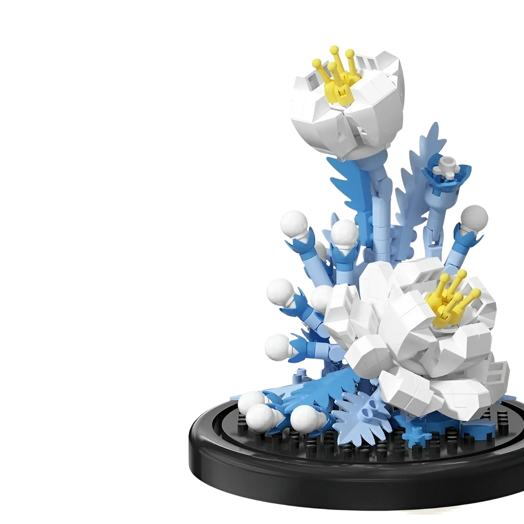 A white and blue plastic flower building blocks sculpture with yellow centers on a black base in a glass dome display case
